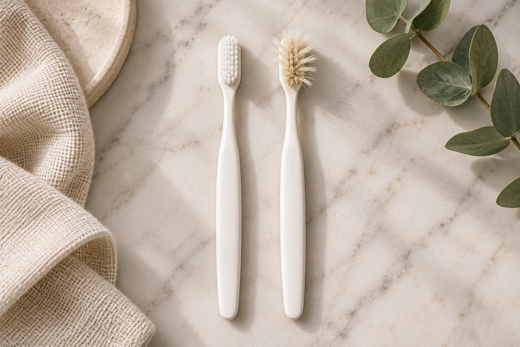 A new toothbrush next to a three-month-old toothbrush with splayed, frayed bristles, seen from above